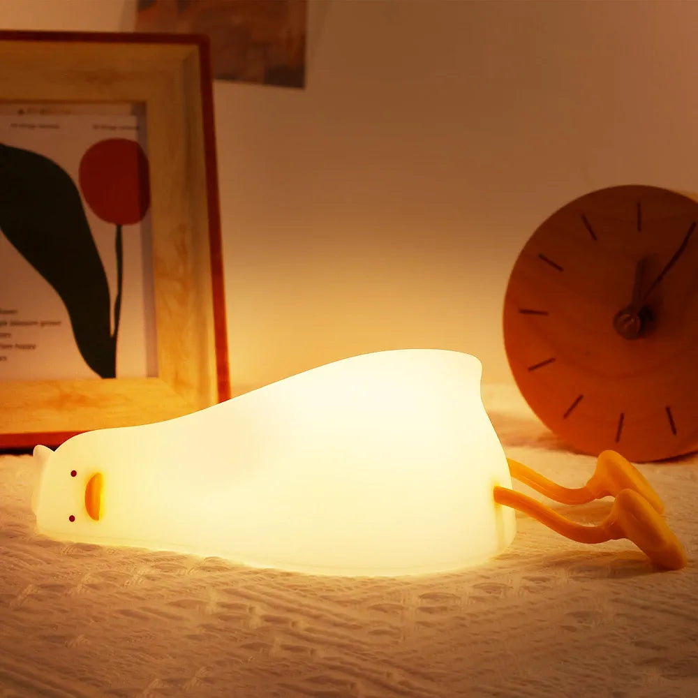 Lie In Peace Duck Sleep Lamp," also known as a "Lying Flat Duck Night Light". It is a rechargeable LED night lamp designed for children.