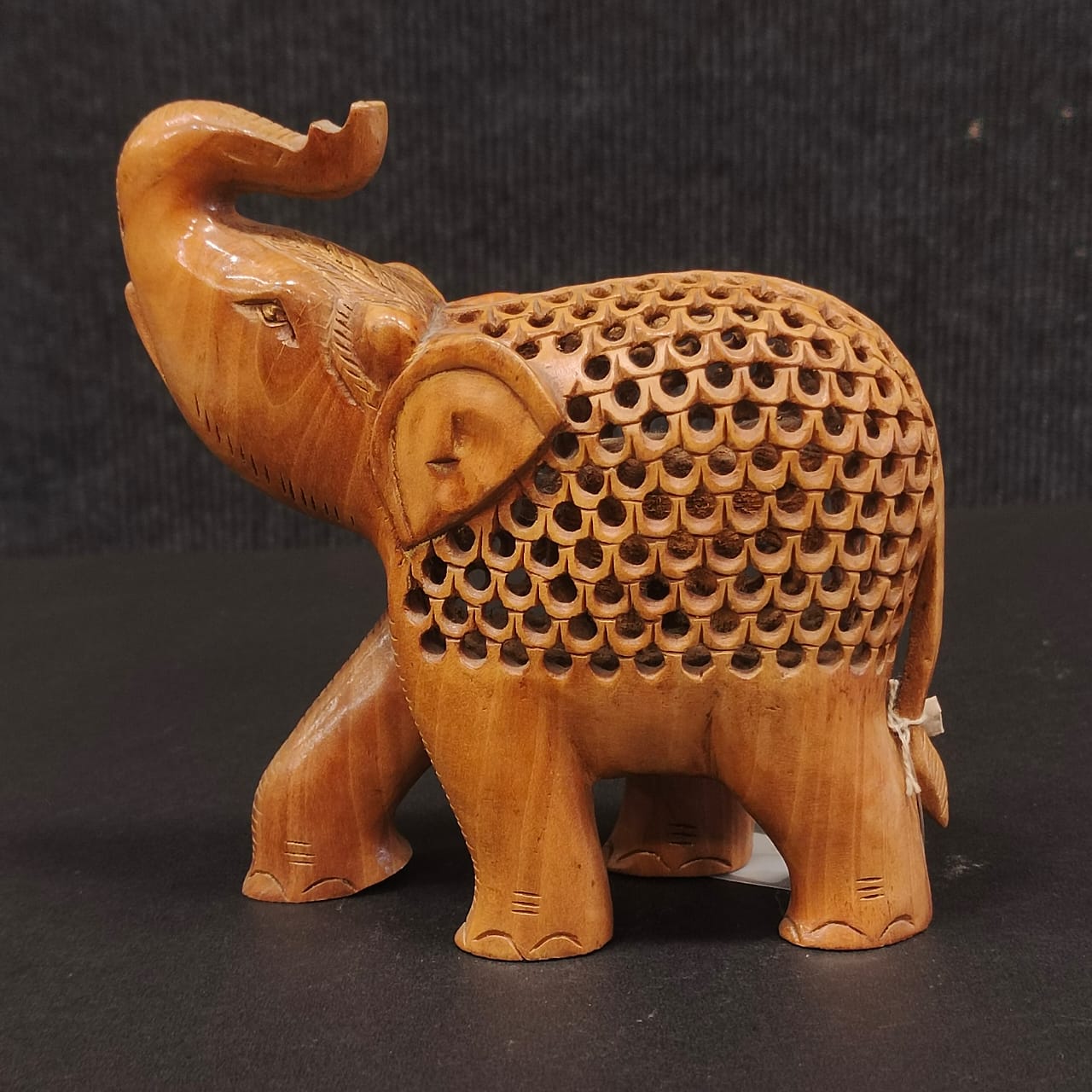 Wooden elephant under ele