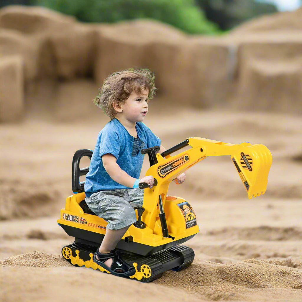Child playing with a toy excavator in an outdoor setting