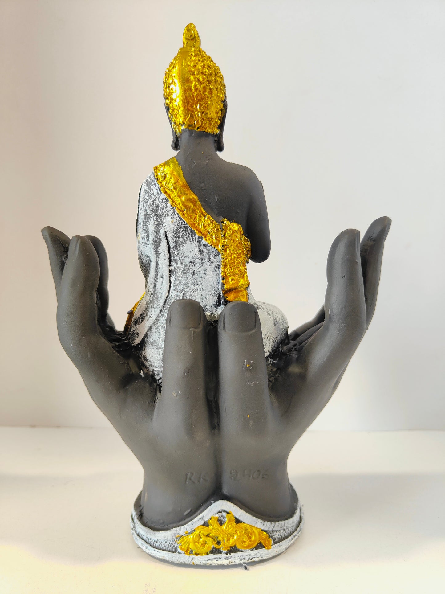 Meditating Lord Buddha Sitting on Hands
