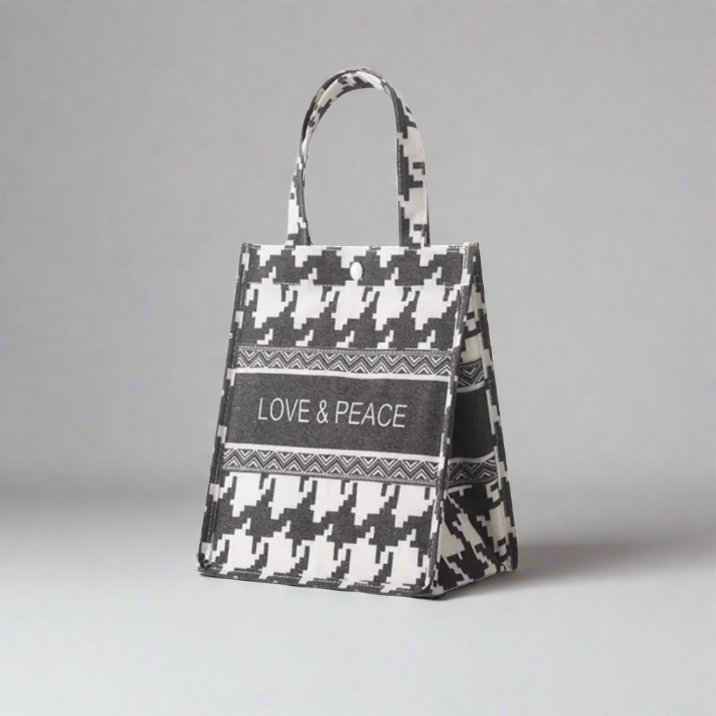 Tote bag with houndstooth pattern and 'LOVE & PEACE' text on a white background