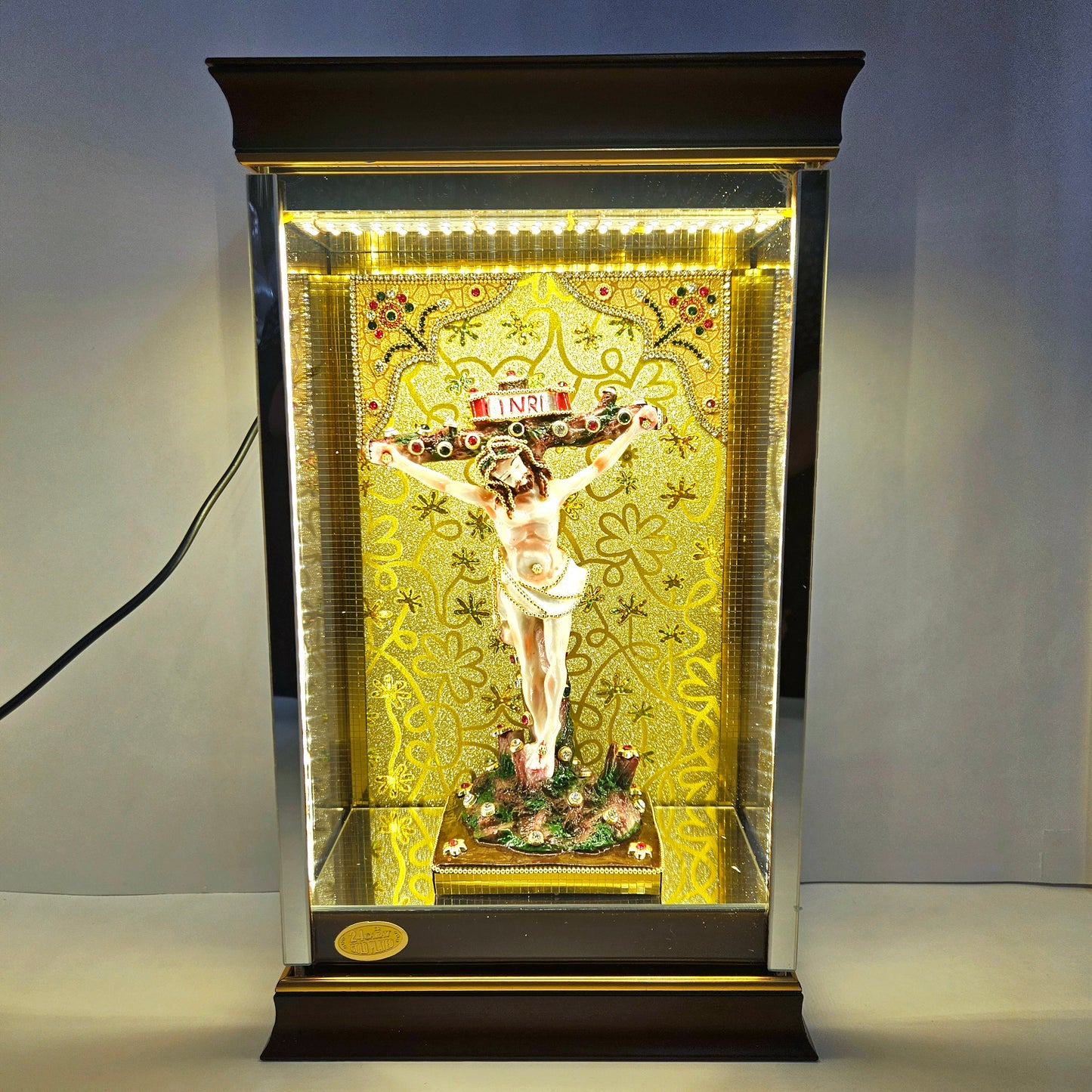 24 carat gold Plated Jesus on cross Statue Decorated with stones in a transparent protective cabin