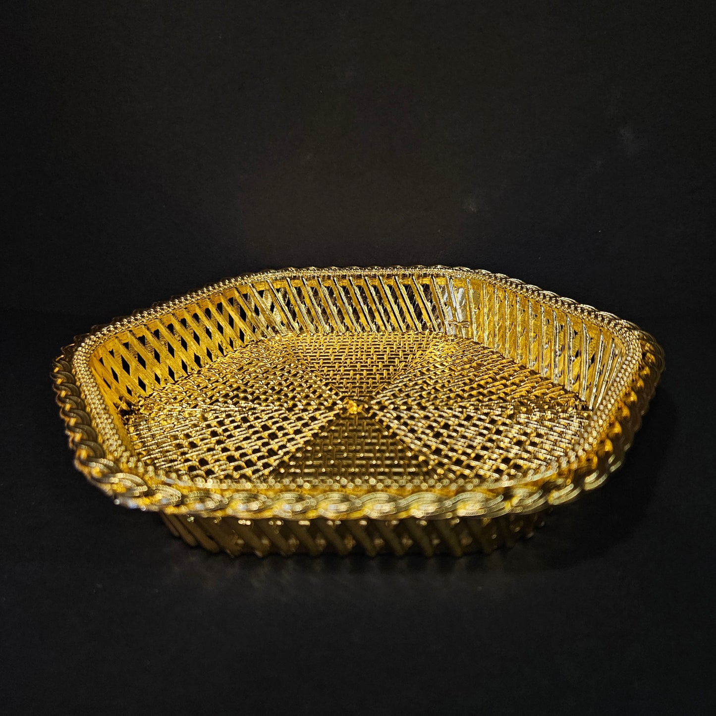 Gold decorative basket on a black background