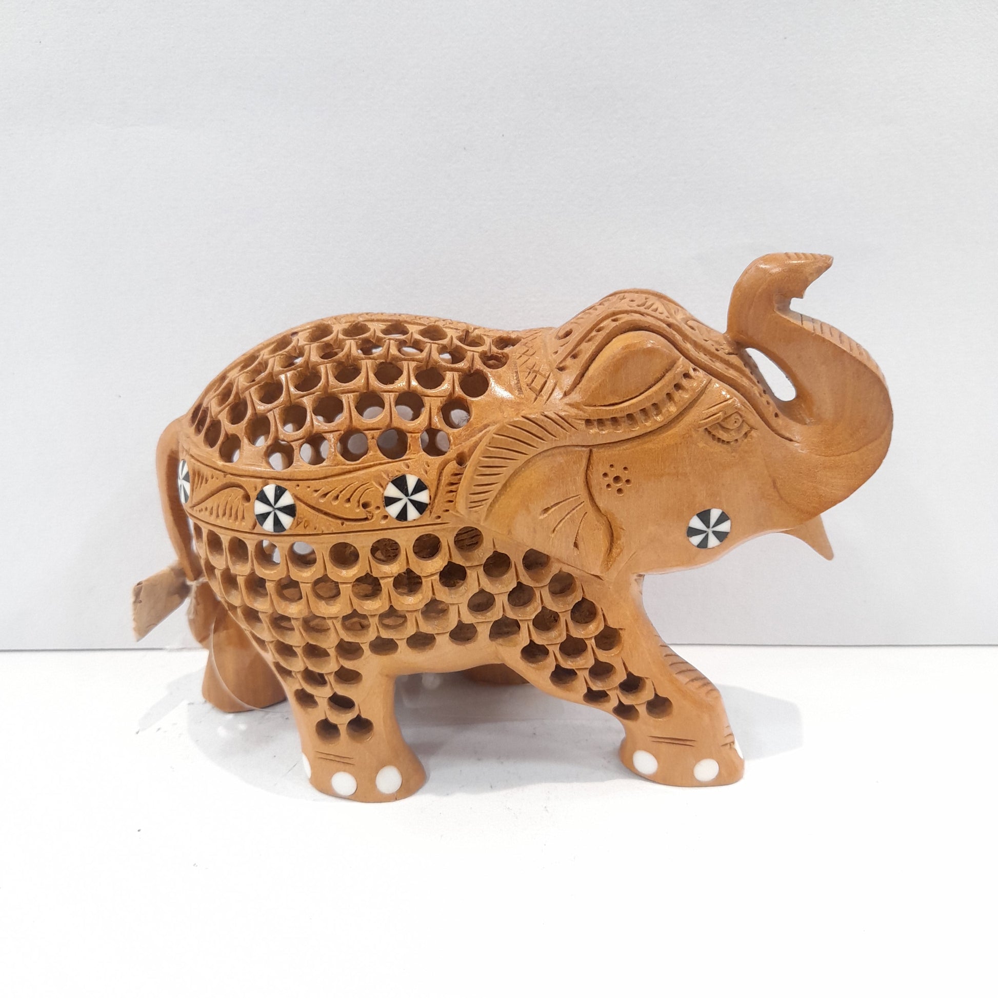 Wooden elephant trunk up with inside ele