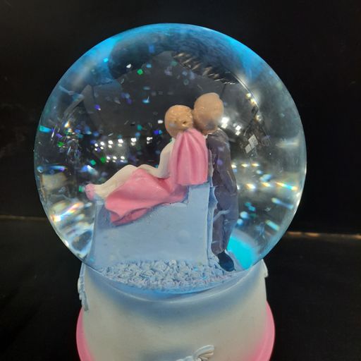 Love couple snow globe