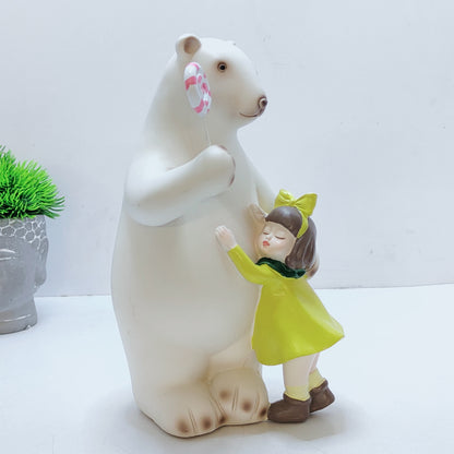 A bear hugs a baby, with a lollipop in his paw