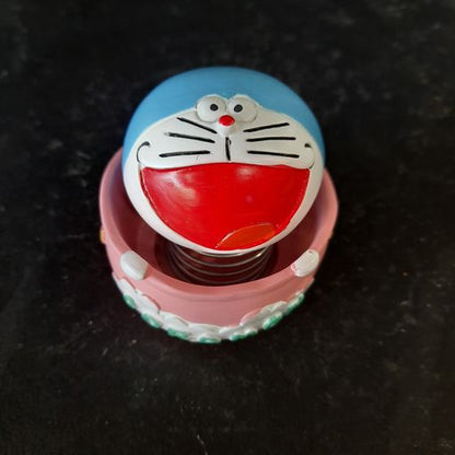 Doramon sitting In a basket bubble head showpiece