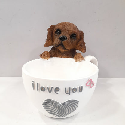 Puppy holding a coffee cup showpiece