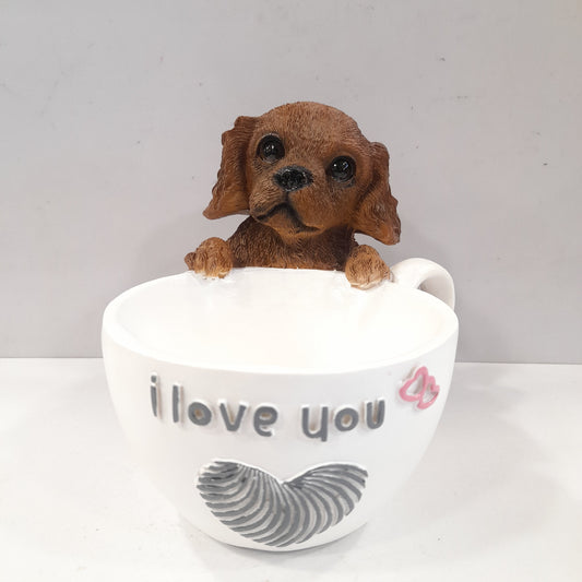 Puppy holding a coffee cup showpiece