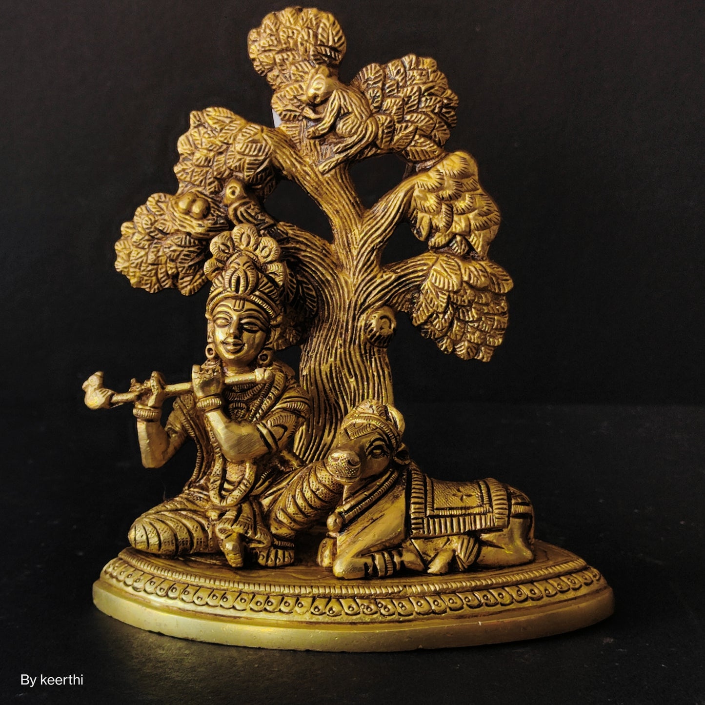 Metal Krishna with Cow Sitting Showpiece Under Tree Plying Flute Decorative Showpiece for for Office,Temple Diwali Janmashtami Puja and Home Kamdhenu Idol