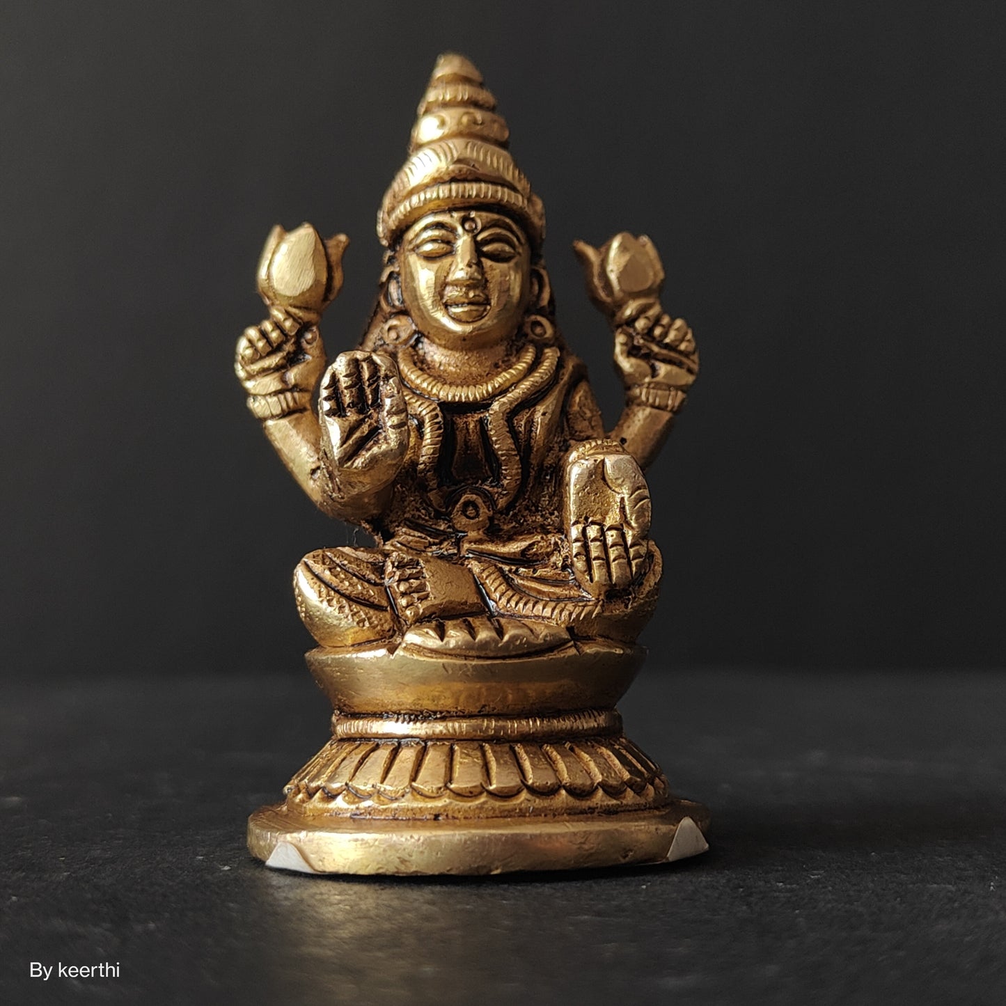 Laxmi Ji Sitting on Round Shape Base Idol