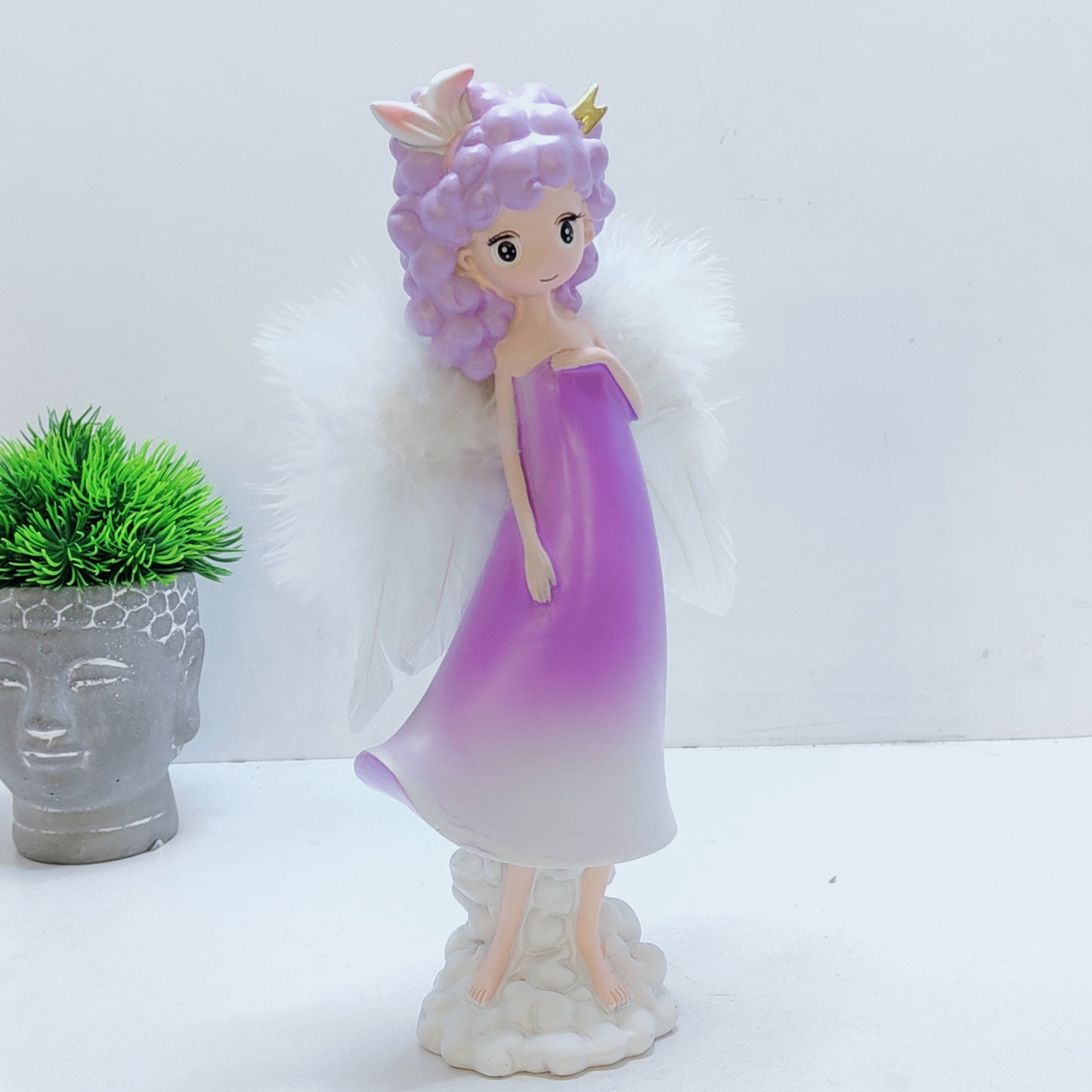 Angel girl with ears or horns on a cloud wings feather
