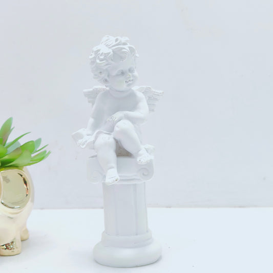 Resin decoration representing an angel on a Pedestal