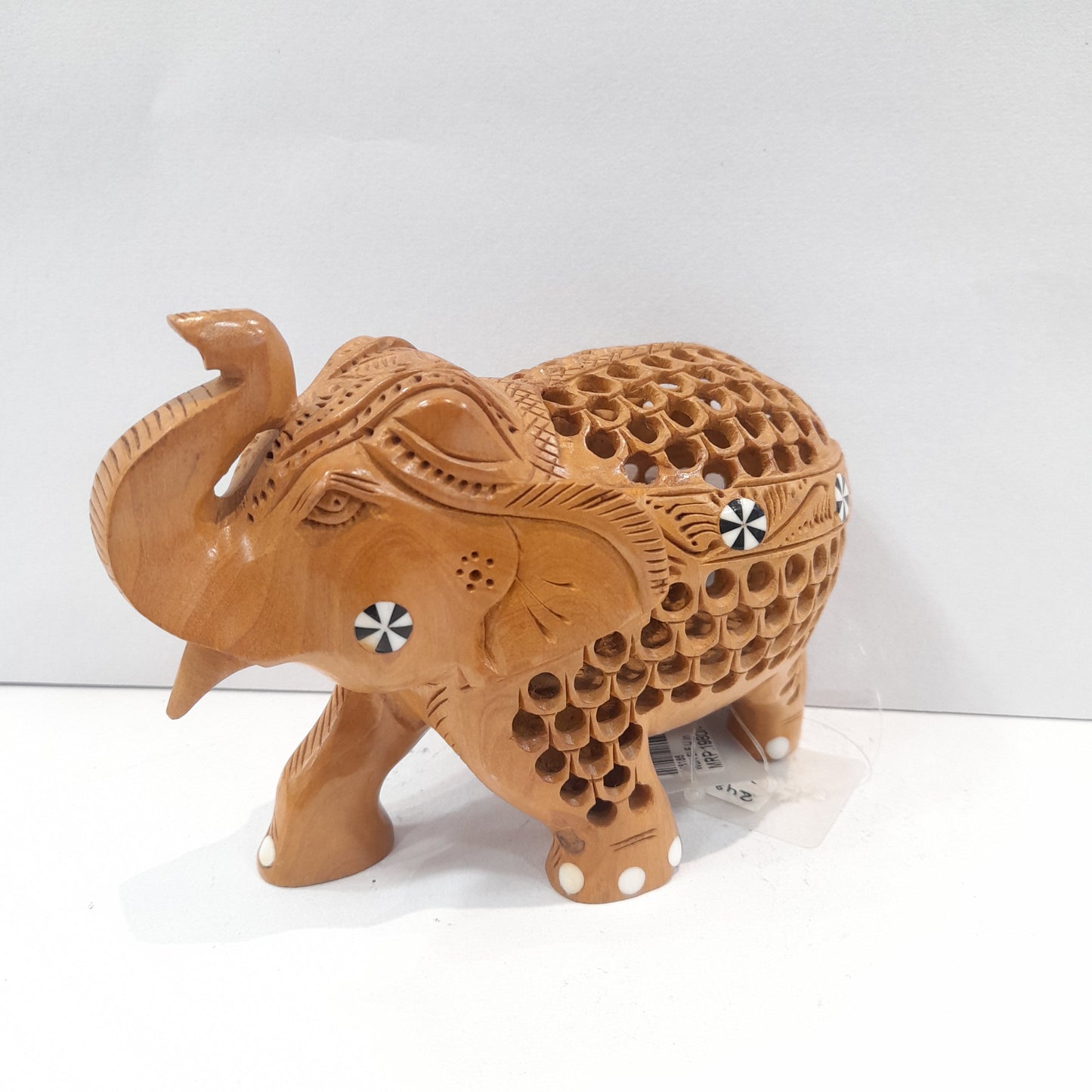 Wooden elephant trunk up with inside ele