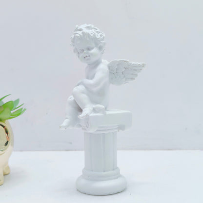 Resin decoration representing an angel on a Pedestal