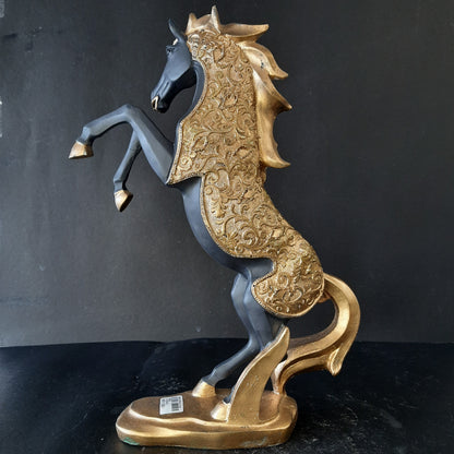 Gold dressed horse standing on two showpiece