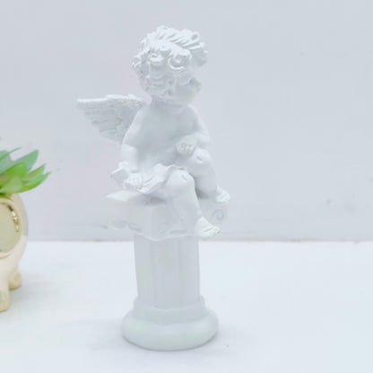 Resin decoration representing an angel on a Pedestal