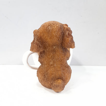 Puppy holding a coffee cup showpiece