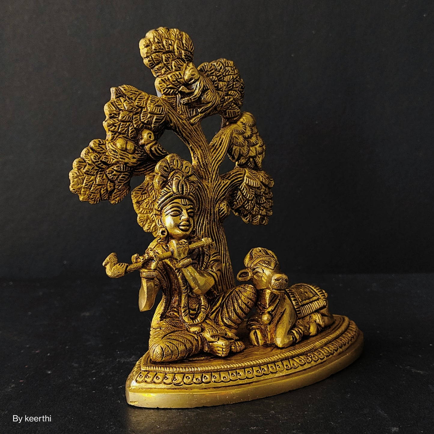 Metal Krishna with Cow Sitting Showpiece Under Tree Plying Flute Decorative Showpiece for for Office,Temple Diwali Janmashtami Puja and Home Kamdhenu Idol