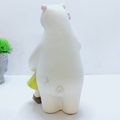 A bear hugs a baby, with a lollipop in his paw