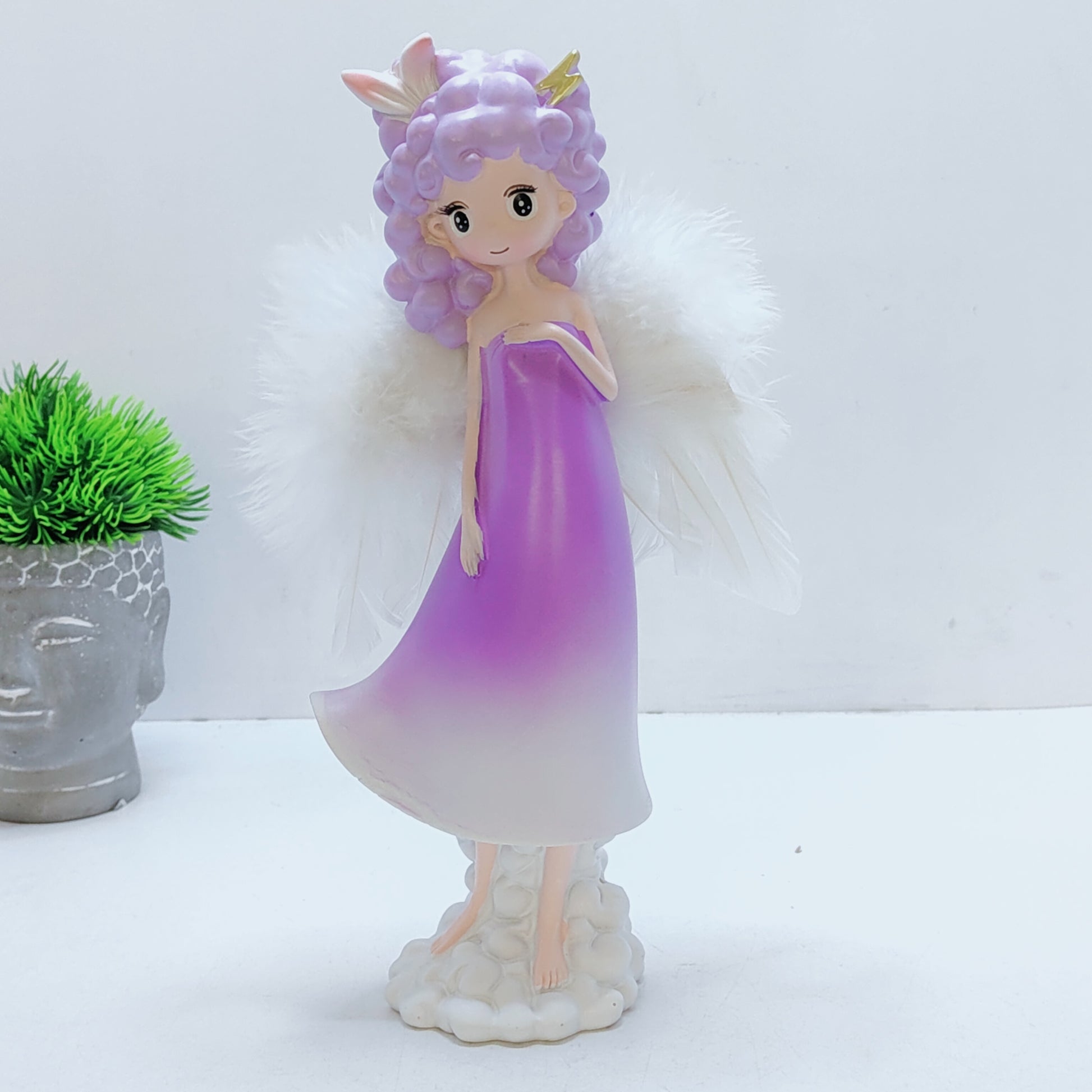 Angel girl with ears or horns on a cloud wings feather