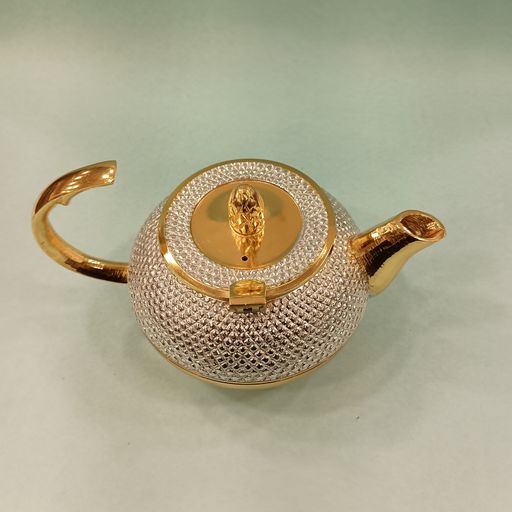 Sliver and gold tea can