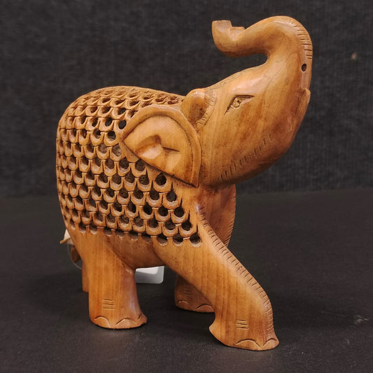 Wooden elephant under ele