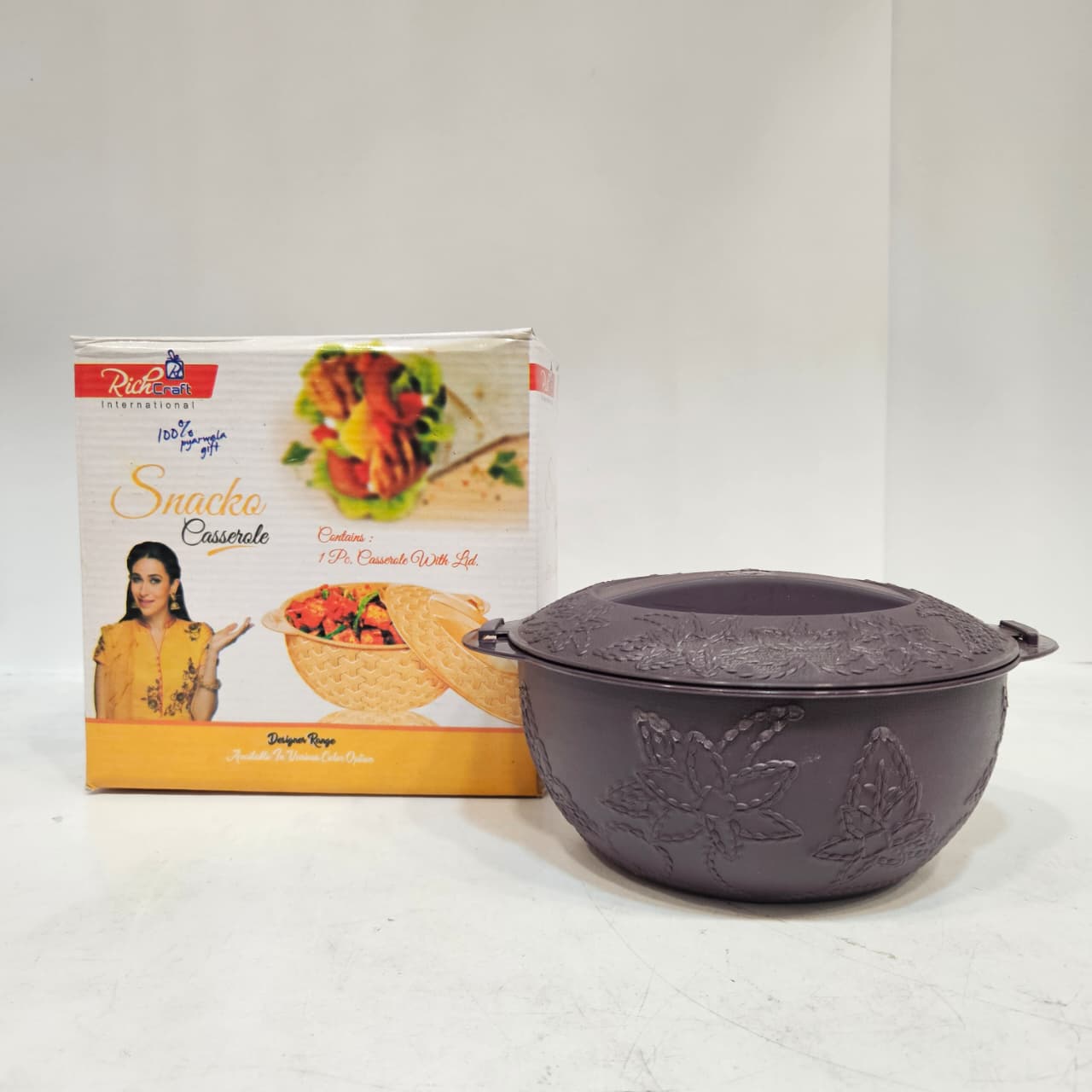 Purple cookware set with a branded box on a white background