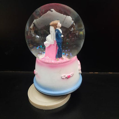 Snow globe couple