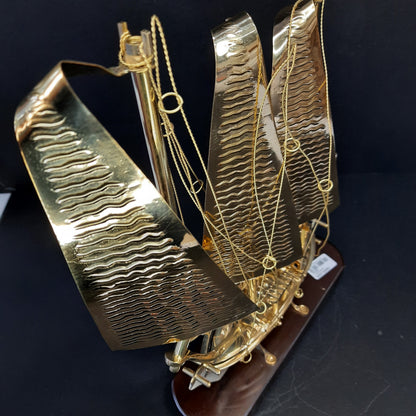 Golden metal ship showpiece