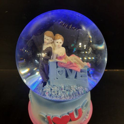 Love couple snow globe