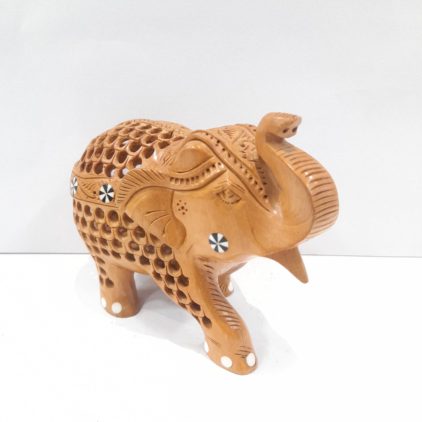 Wooden elephant trunk up with inside ele
