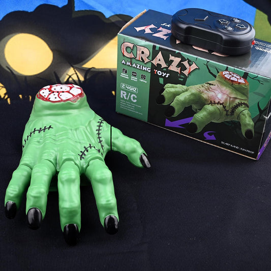 Green toy hand with zombie design next to its packaging on a dark background