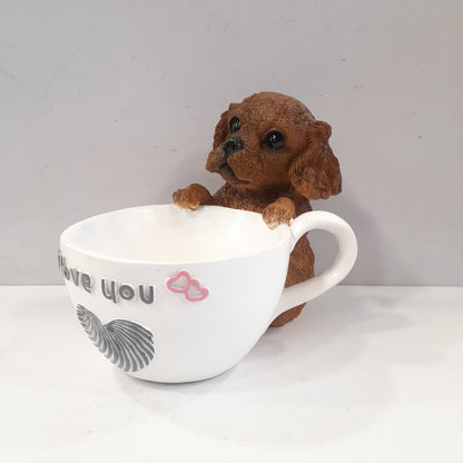 Puppy holding a coffee cup showpiece