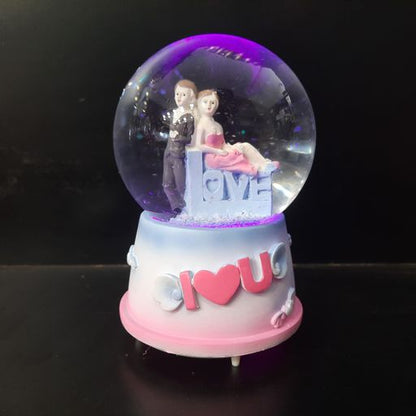 Love couple snow globe