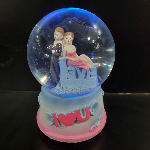 Love couple snow globe