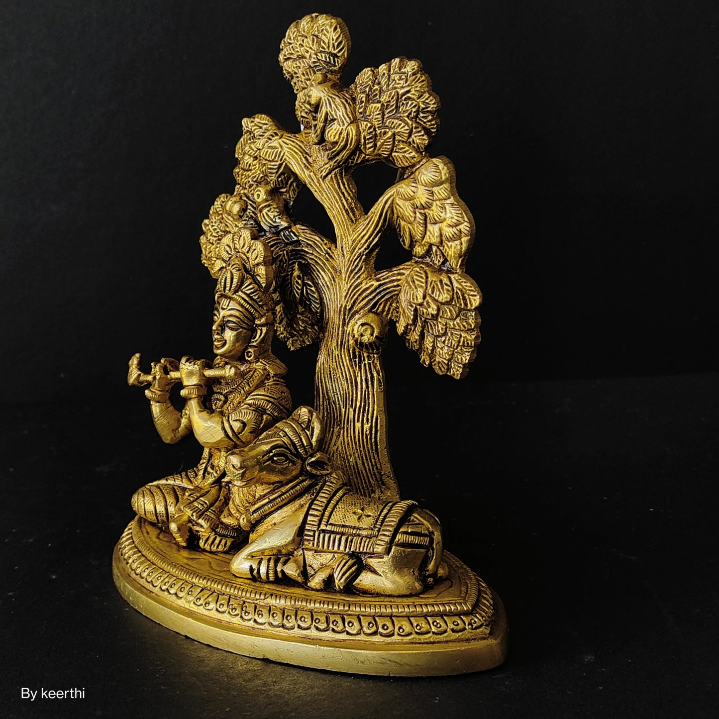 Metal Krishna with Cow Sitting Showpiece Under Tree Plying Flute Decorative Showpiece for for Office,Temple Diwali Janmashtami Puja and Home Kamdhenu Idol