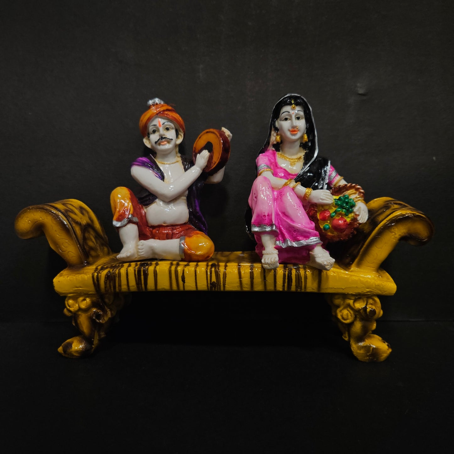 Traditional rajastani Couple sitting on wooden cot showpiece Figurine