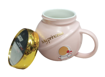 pink mug with a golden lid, featuring an astronaut design and the text "My princess". The mug is likely a novelty item or a gift,  children or those who appreciate cute designs.