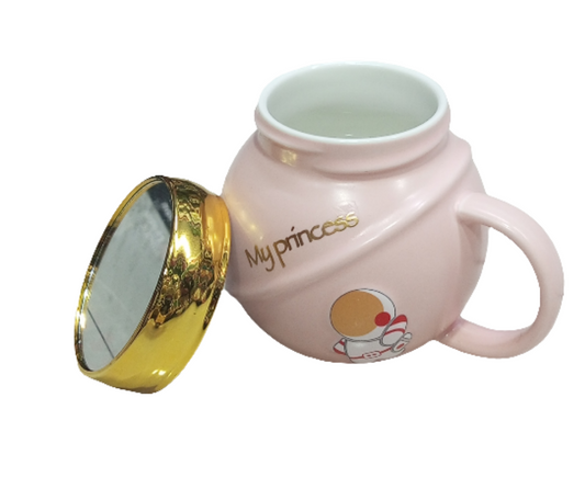 pink mug with a golden lid, featuring an astronaut design and the text "My princess". The mug is likely a novelty item or a gift,  children or those who appreciate cute designs.