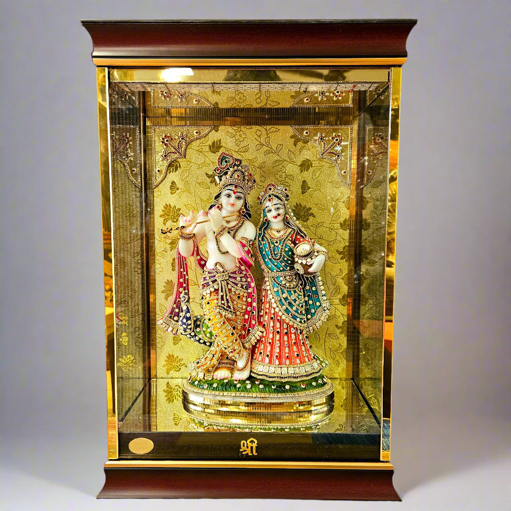 24 carats gold Plated radha Krishna Idol Statue Decorated with attractive stones in a transparent protective cabin with lights