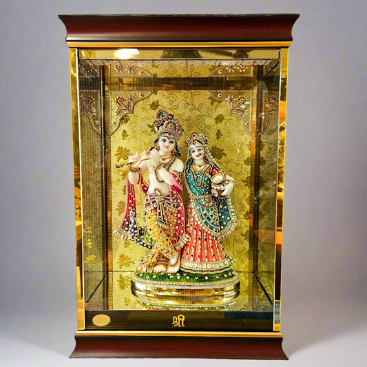 24 carats gold Plated radha Krishna Idol Statue Decorated with attractive stones in a transparent protective cabin with lights