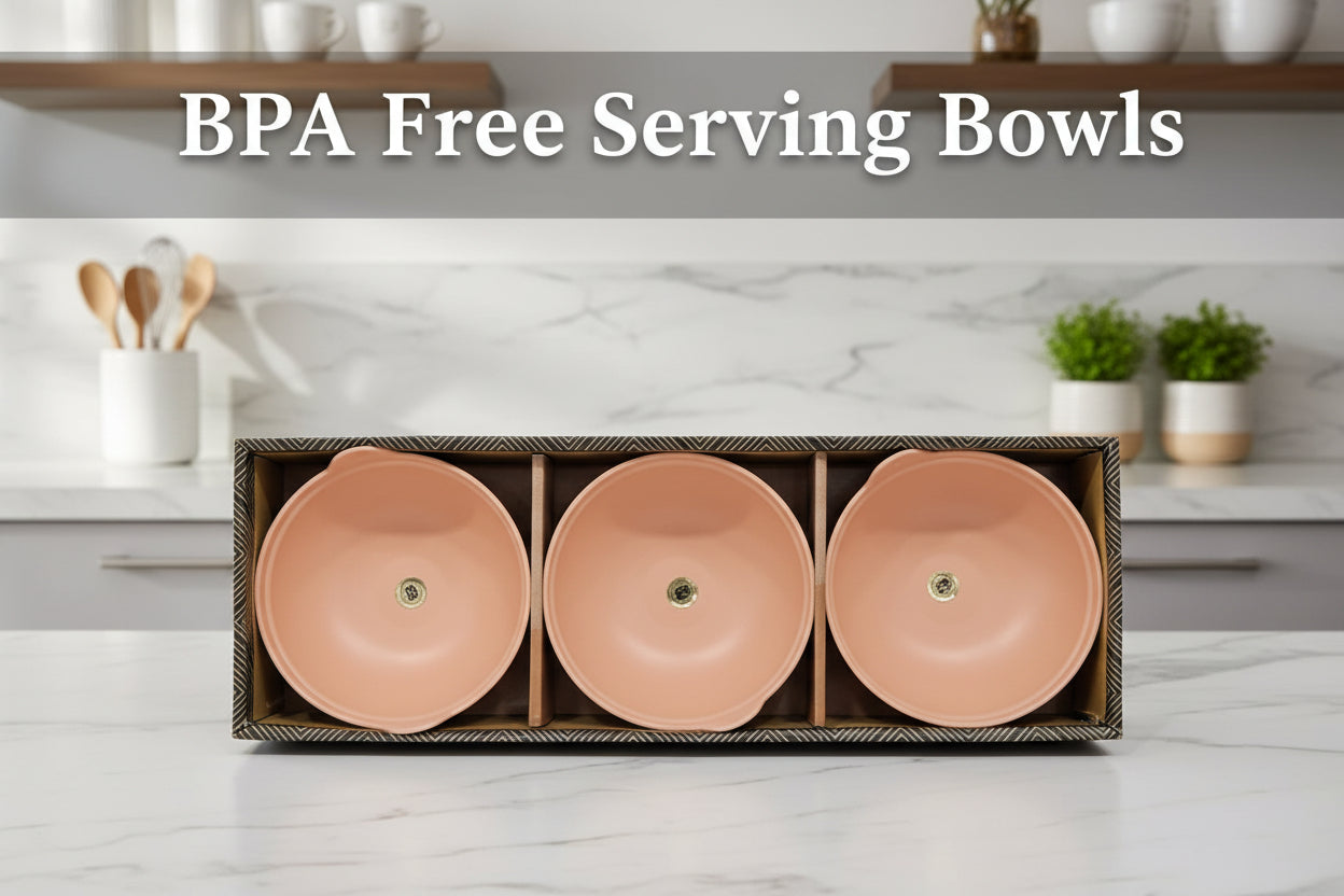 Three terracotta bowls in a wooden box on a light gray background