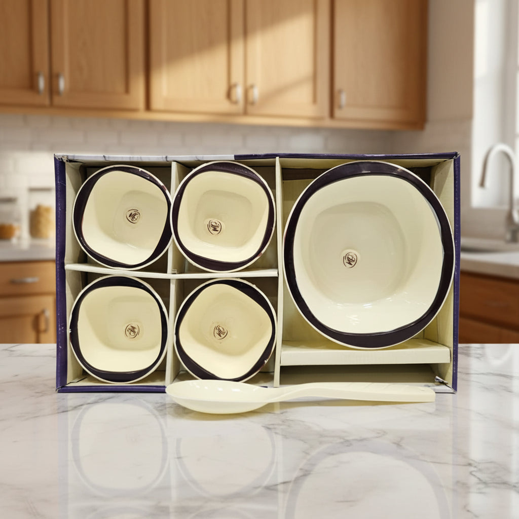 Set of four ceramic bowls with a spoon in a box on a gray background