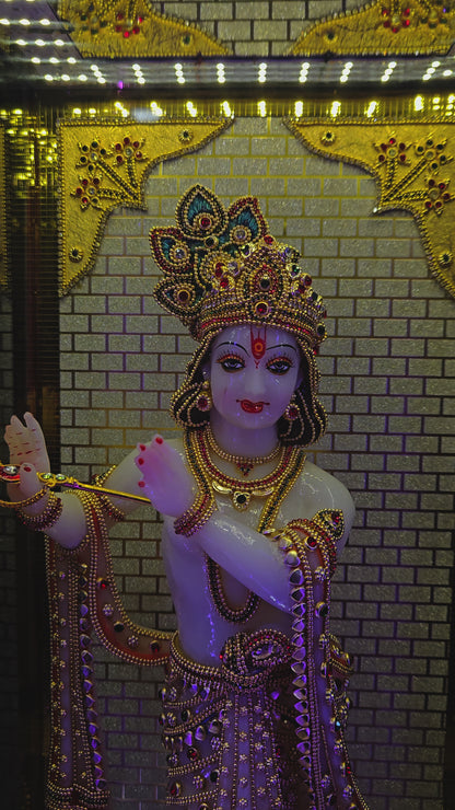 24carats gold Plated Krishna Statue idol Decorated with attractive stones in a transparent protective cabin