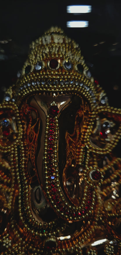 24 carat gold Plated vinayaka idol with stone designer,transparent protective cabin