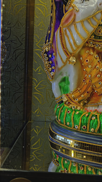gold Plated radha Krishna Decorated with stones work idol Statue in a transparent protective cabin
