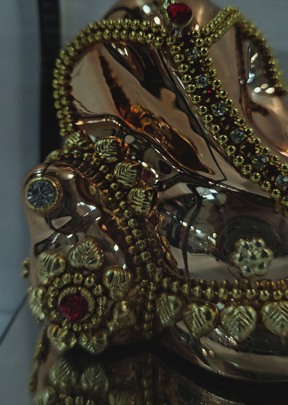 Lord vinayaka murti in sitting posture 24carats gold Plated idol Statue in a transparent protective cabin