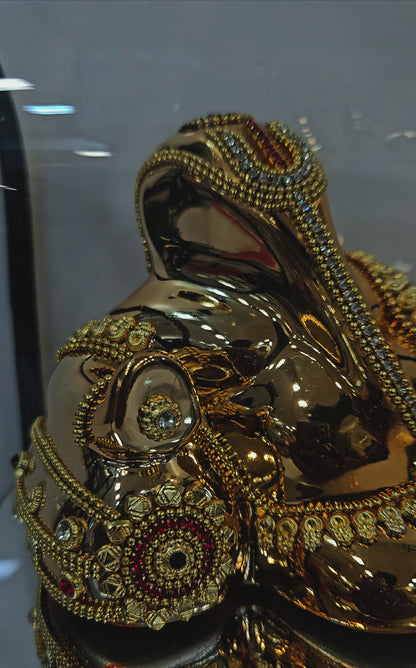 Lord Vinayaka murti 24carats gold Plated idol with attractive stones designed Statue in a transparent protective cabin