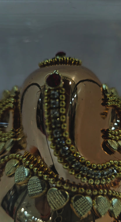 24carats gold Plated vinayaka idol Statue Decorated with attractive stones in transparent protective cabin